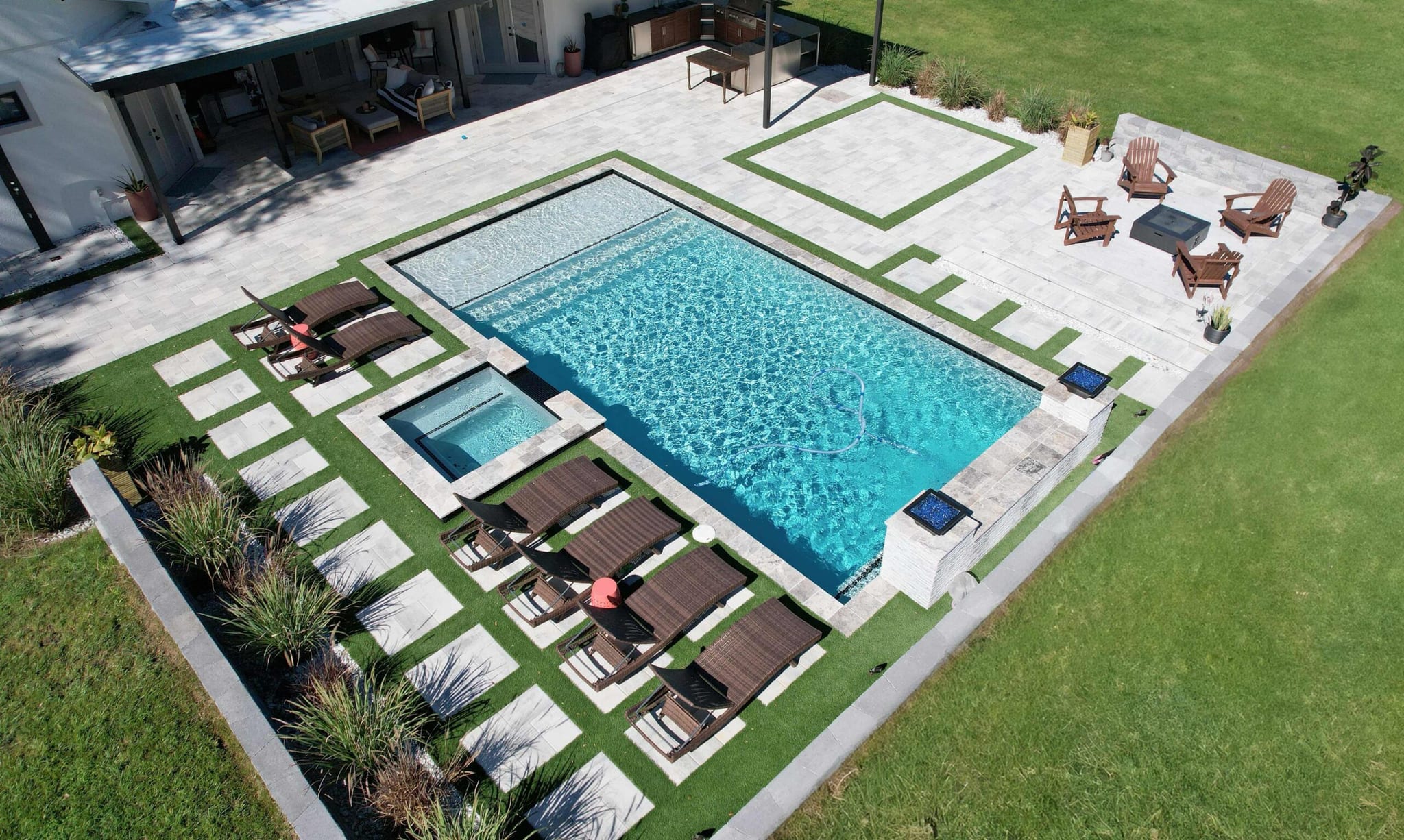 Aerial view of a custom Grunit pool and complete backyard environment
